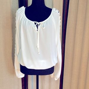 White blouse by xoxo size medium. Crochet on sleeves. Excellent condition.